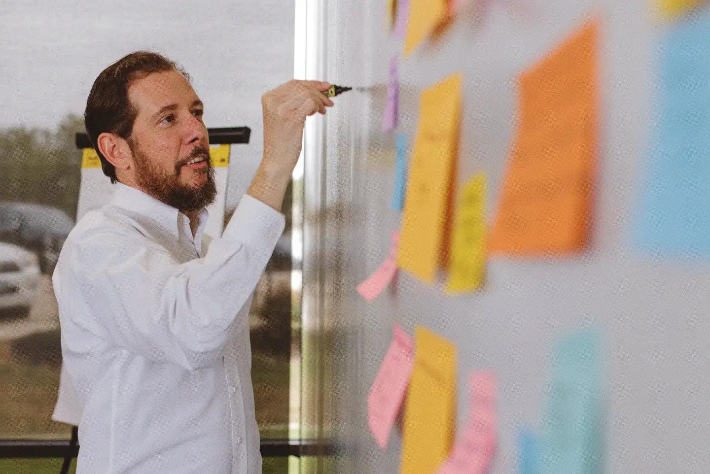 A VDP workshop room: laptops, sticky notes, and the people who know the work
