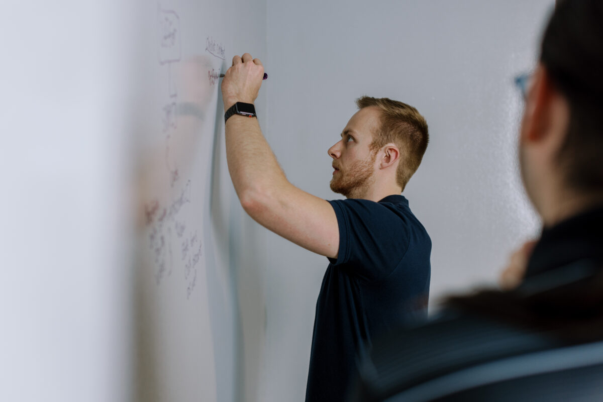 Koby Bailey, writer behind 'Pursuing Growth: 3 Roadblocks to Personal Growth and How to Overcome Them' brainstorming at Frogslayer